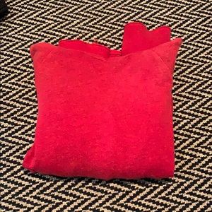 A red hoodie from the brand Sundry